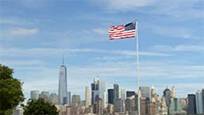 USA Flag Flying in front of New York Skyline