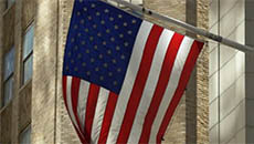 Close Up of USA Flag Flying on Wall Street
