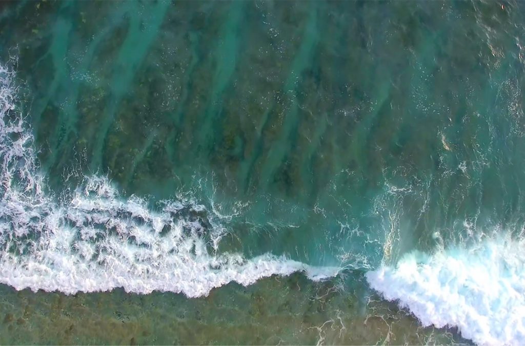 Drone footage of crashing waves