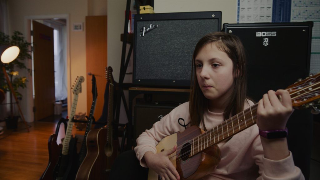 Softbox lighting on a girl playing guitar